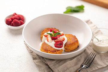 Portion of appetizing russian syrniki pancakes breakfast