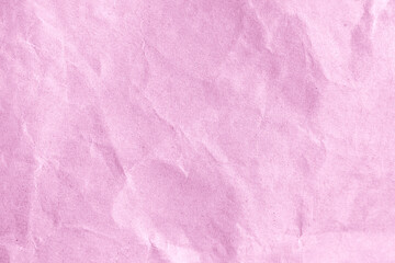 Wrinkled pink paper as a background or wallpaper