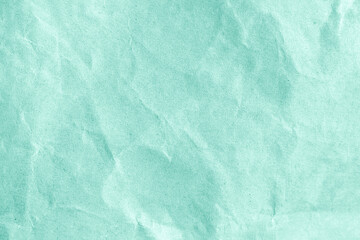 Wrinkled ocean blue paper as a background or wallpaper