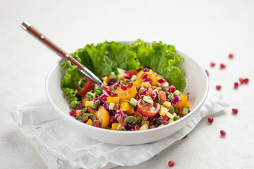 Portion of gourmet healthy fresh salad with tomatoes