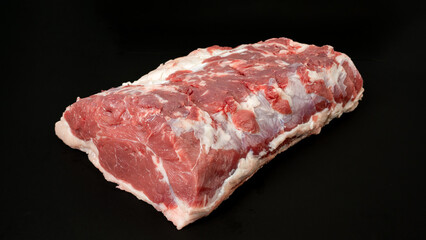 Cut of raw meat beef on black background