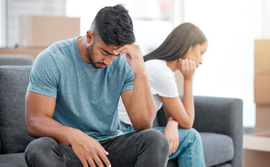 Couple, fight and break up of man feeling depressed on living room sofa with relationship problem....