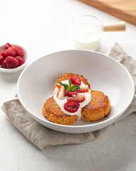 Portion of appetizing russian syrniki pancakes breakfast