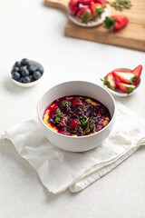 Portion of healthy gourmet breakfast porridge with berries