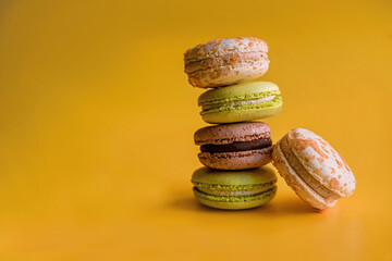 Flavorful Delights: Assorted Stacked Macaroons on Colorful Background