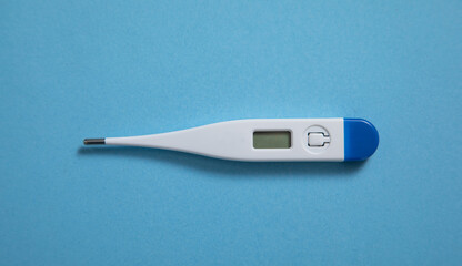 Thermometer on the blue background.