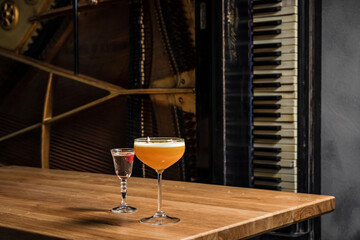 Porn star martini cocktail with passion fruit and vodka at the wooden table at bar or restaurant
