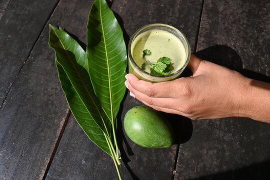 Raw Mango Drink. This is a traditional and most popular drink of Indian in summer. It's other names Kairi panha, Panna, Raw Mango juice. Drink beverage served in a glass. Selective focus.