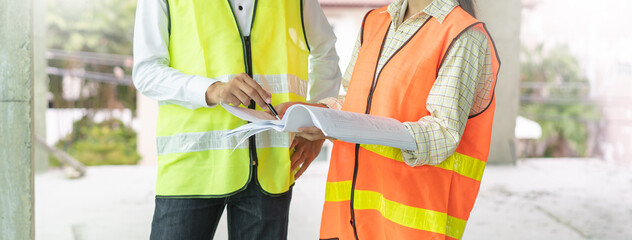 Builder inspection consultancy. Two engineer consulting and checking material and structure in...