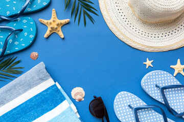 Summer vacation concept flat lay. straw hat beach accessories and towel top view. Space for text....