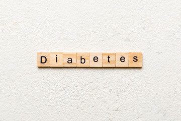 diabetes word written on wood block. diabetes text on table, concept