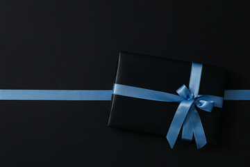 Gift box on black background, top view