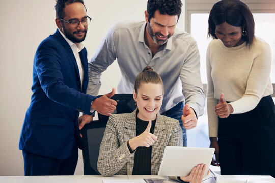 Business people, tablet and video call with thumbs up for winning, promotion or team approval at office. Group of happy employees on technology in virtual meeting with thumb emoji, yes sign or like