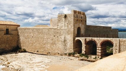 Fototapeta na wymiar Bridge of the Castle of Meniace in Siracusa Ortigia Island in Sicily