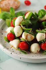 A plate with Italian salad caprese canape
