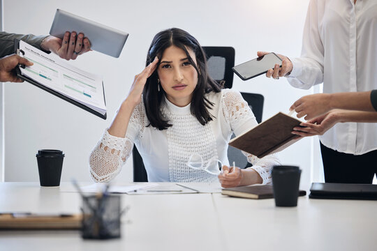 Portrait, multitask and an overworked business woman at work on a laptop in her office for a deadline. Technology, burnout or stress with a young female employee feeling pressure from a busy schedule