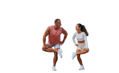 Swedish young adult man in sportswear training with wife against transparent background. Caucasian couple warming up before functional training. Cheerful tanned woman looks at trainer.