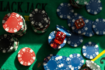 Blur background and chips, Stack of poker chips on a green table. Poker game theme
