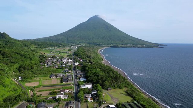 Kagoshima, Japan: Aerial drone footage of the stunning coast of Kyushu with the Kaimon volcano by the sea in Japan. 