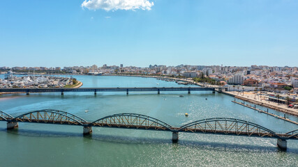 Portuguese bridges over the river Arade overlooking the city of Portimao. Ponte Velha old bridge.