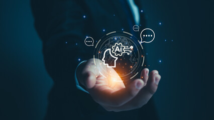 bussiness man holding brain of AI, Symbolic, Machine learning, artificial intelligence of futuristic technology. AI network of brain on business analysis. chat bot.