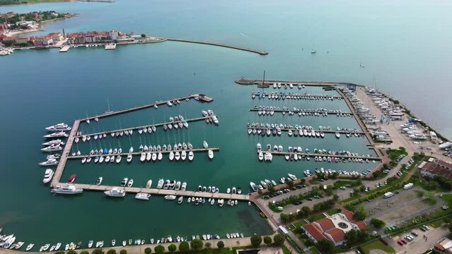 Umag marina port, Umag old town behind. Croatia.
