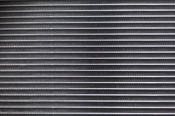 Texture of a car radiator. Engine cooler background. Vintage style. Radiator grille for car...