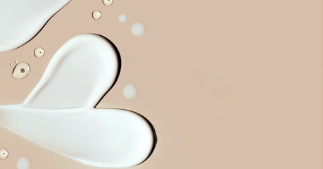 cosmetic smear of cream in the shape of a heart on a beige background with a place for text