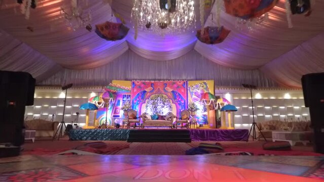 Drone shot of a Mehndi event setup, stage and dance floor in a grand pakistani wedding