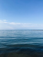 Blue transparent sea surface, blue sea horizon, clear blue sky