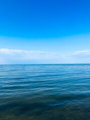 Blue transparent sea surface, blue sea horizon, clear blue sky