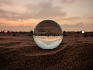 Fototapeta na wymiar glass globe reflection of desert