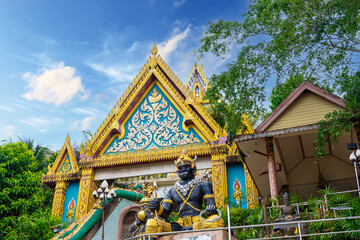 Fototapeta na wymiar Beautiful Wat Buddhist temples in Old Phuket town Thailand. Decorated in beautiful ornate colours of red and Gold and Blue. Khao Rang Hill