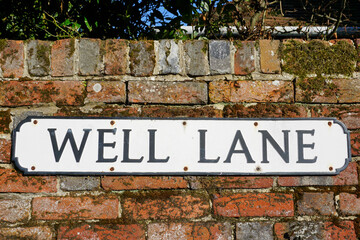Street sign for Well Lane. vintage style street name sign in England 