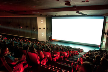 people watching movie in cinema - obrazy, fototapety, plakaty