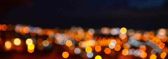 Abstract blurred bokeh background of night city or Christmas garland lights.
Soft focus.