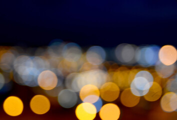 Abstract blurred bokeh background of night city or Christmas garland lights.
Soft focus.