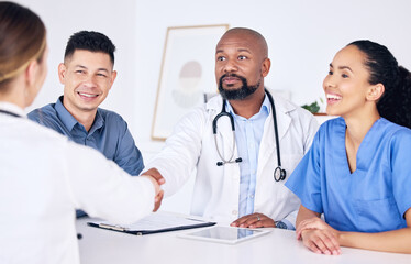 Handshake, teamwork or happy doctors in meeting for success, medical surgery contract or healthcare goals. Partnership, trusted black man or happy woman shaking hands with a nurse in hospital office