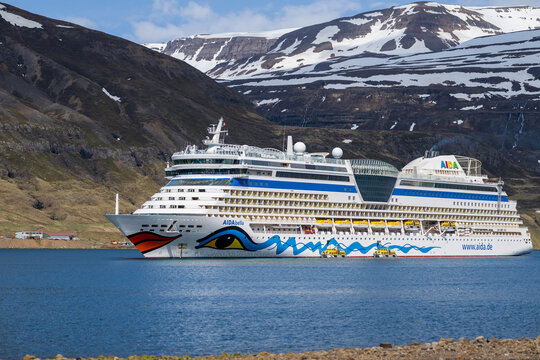 Seydisfjordur, Iceland, May, 21 -2023 : the german cruise ship aida bella anchoring in the fjord in front of seydisfjordur harbor on iceland 