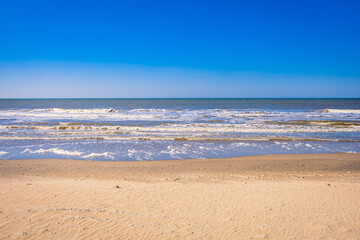 Fototapeta na wymiar A Sunny Day at the Yellow Sand Beach near The Hague