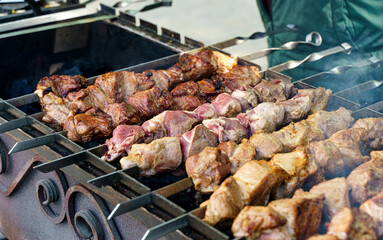Kebab grill bbq cooking outside on mangal. Meat, food, picnic concept.