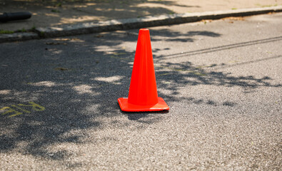 Orange construction cones represent construction zones, roadwork, caution, and temporary barriers...