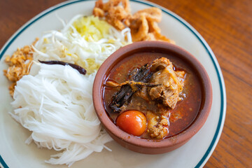 Khao Soi Nam Ngiao or Nam Ngiao is a noodles soup or curry of the cuisine Northern Style Curried Noodle Soup with braised pork ribs is the favorite delicious food of Northern Thai cuisine.