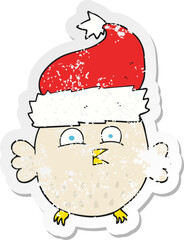 retro distressed sticker of a cartoon owl wearing christmas hat