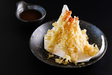 Shrimp tempura Japanese food isolated on a black background