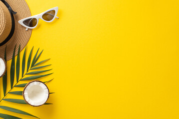 Escape to a summer getaway with this captivating top view flat lay. Showcasing a sunhat, palm leaves, sunglasses, coconut on a bright yellow backdrop, the empty space awaits your text or advert