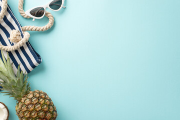 Immerse yourself in the essence of summer vacation with this captivating top-down view of sunglasses, fruit, bag, on a tranquil pastel blue surface. An empty space invites your text or advert - obrazy, fototapety, plakaty