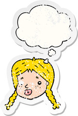 cartoon girls face with thought bubble as a distressed worn sticker