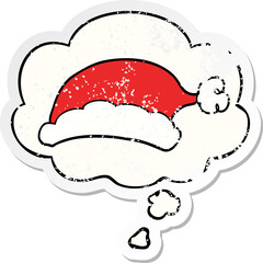 cartoon christmas hat with thought bubble as a distressed worn sticker