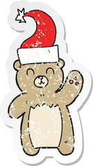retro distressed sticker of a cartoon teddy bear waving